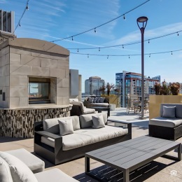 Love where you live outdoor patio with seating and fireplace