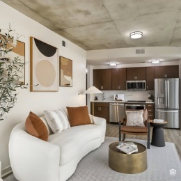 Stylish living areas to relax and unwind living area with a couch, chair and coffee table