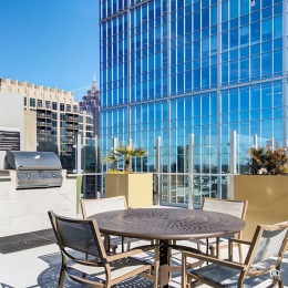 Everything within reach outdoor grilling area with tables and chairs